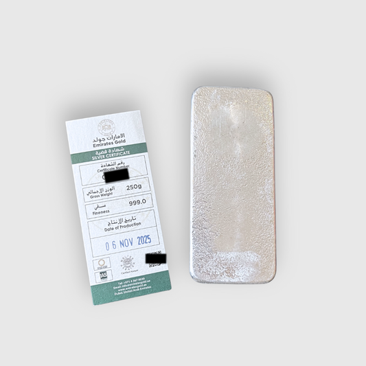 Silver bar with packaging on a light gray background