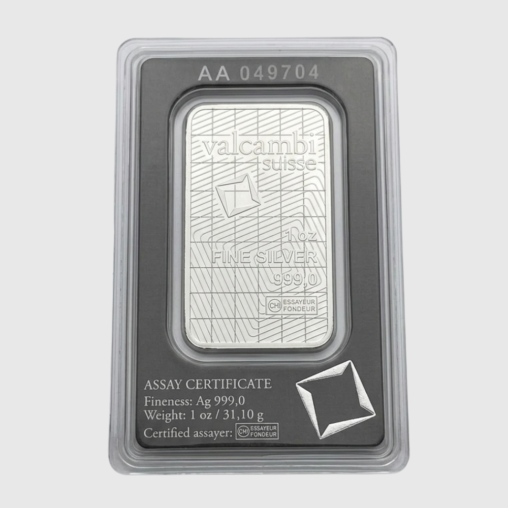 Silver bar in protective packaging with Valcambi Suisse branding on a light gray background