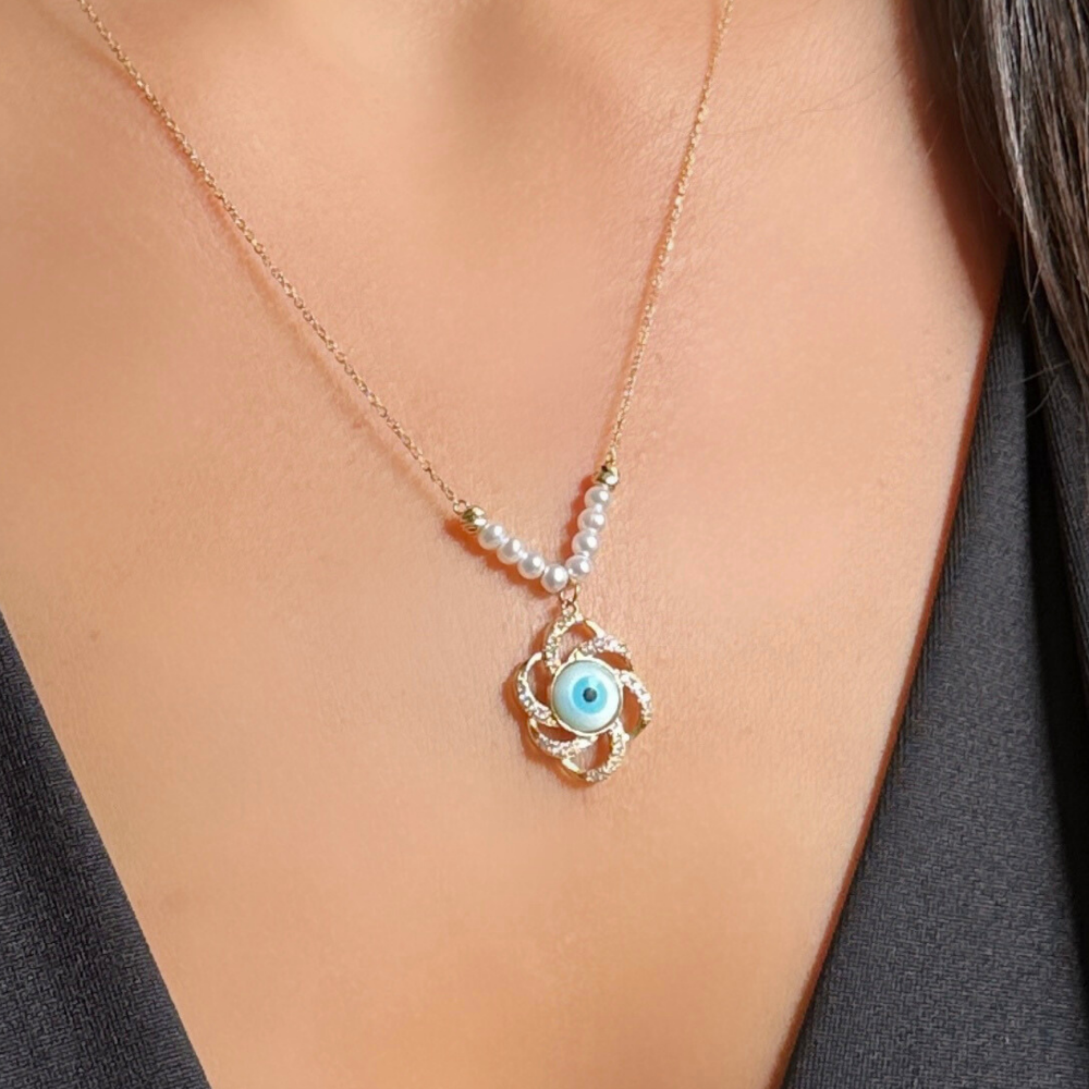 Eye, flower shape and pearls - gold necklace