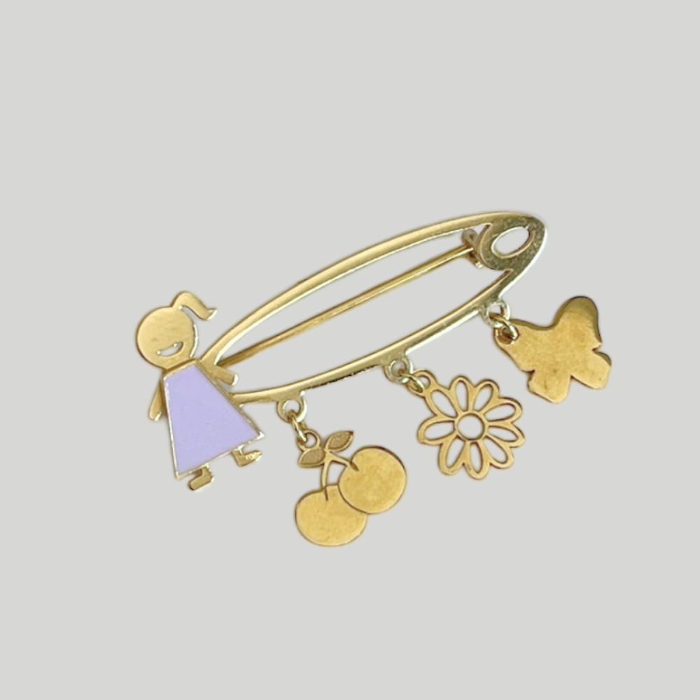 Gold safety pin – girl and charms