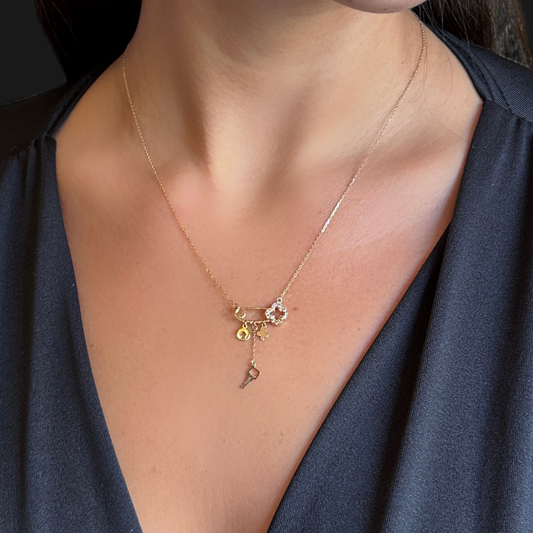 Safety pin necklace – clover and charms