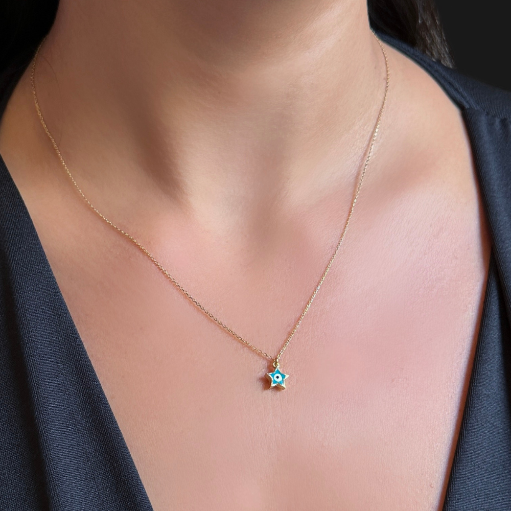 Mini star and eye – gold necklace