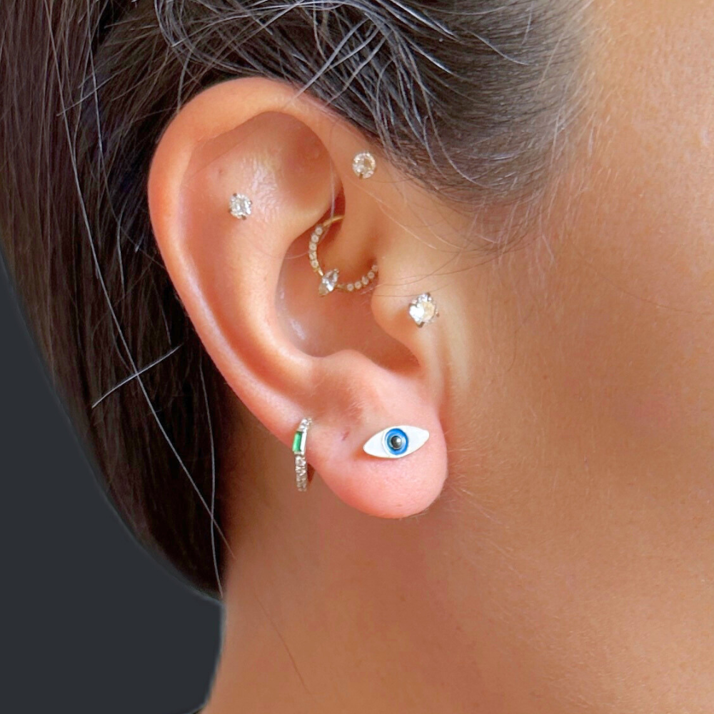 White Eye shaped gold earrings