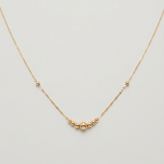 One large ball - straight line ball necklace