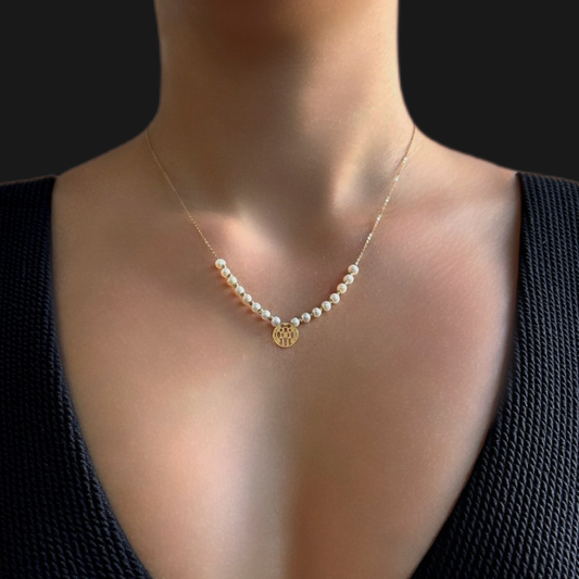 Perforated Disk and Pearl necklace