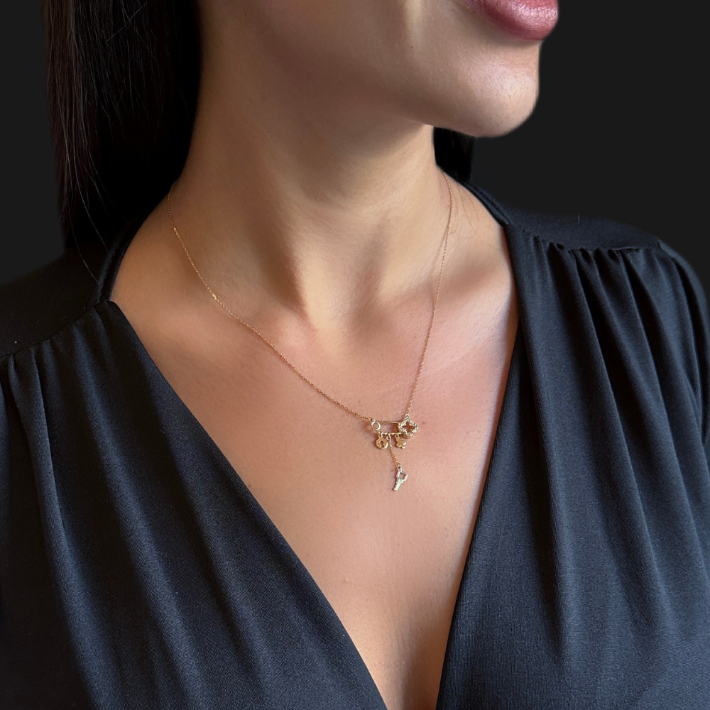 Safety pin necklace – clover and charms