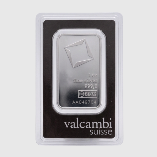 Silver bar in packaging with Valcambi Suisse branding on a light gray background