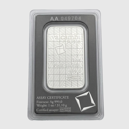 Silver bar in protective packaging with Valcambi Suisse branding on a light gray background