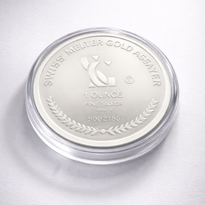 Silver coin in a protective case with 'Swiss Melter Gold Assayer' branding on a white background