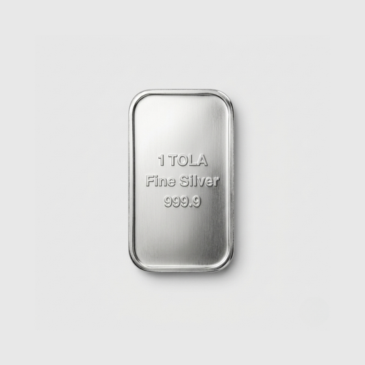 Silver bar with '1 TOLA Fine Silver 999.9' text on a light gray background