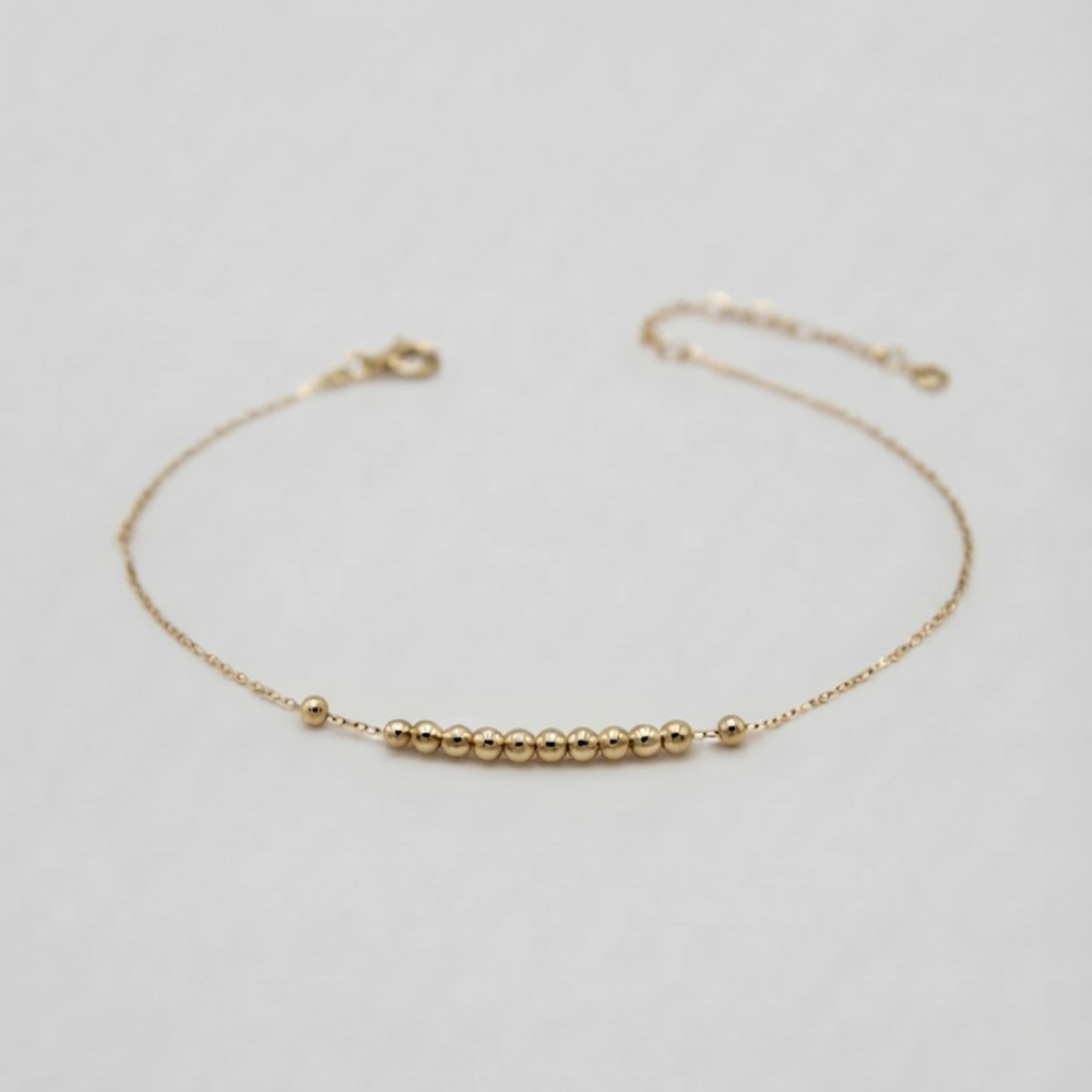 Straight line mini balls gold bracelet