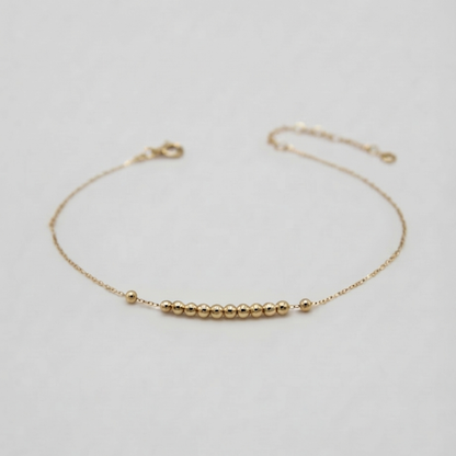 Straight line mini balls gold bracelet