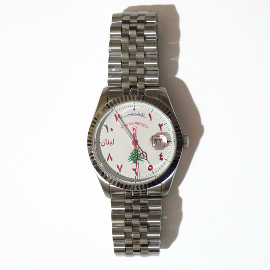 Lebanon Watch - lulia jewelry x west end watches Silver watch with a white face displaying Arabic numerals on a white background