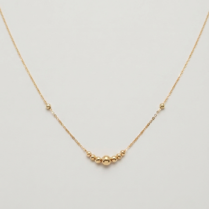 One large ball - straight line ball necklace