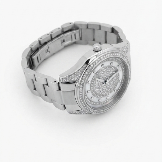 A Tony Valentino silver-tone stainless steel watch with a matching link bracelet, featuring a round bezel set with small clear crystals, a detailed ornate dial, and crystal hour markers on a white background.