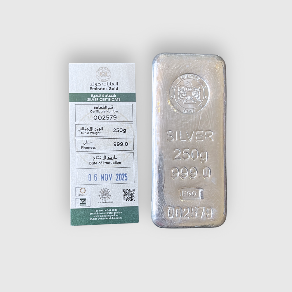 Silver bar with Emirates Gold certificate on a white background