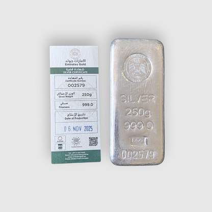 Silver bar with Emirates Gold certificate on a white background