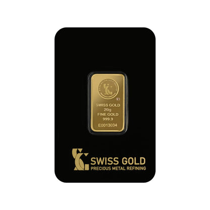 Gold bar with 'Swiss Gold' branding on a black card