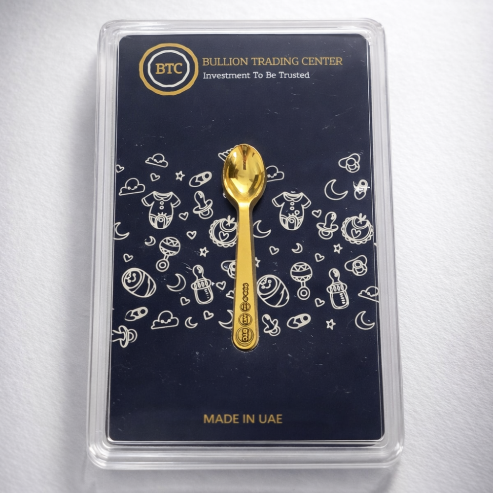 24k gold Gold spoon on a packaging card