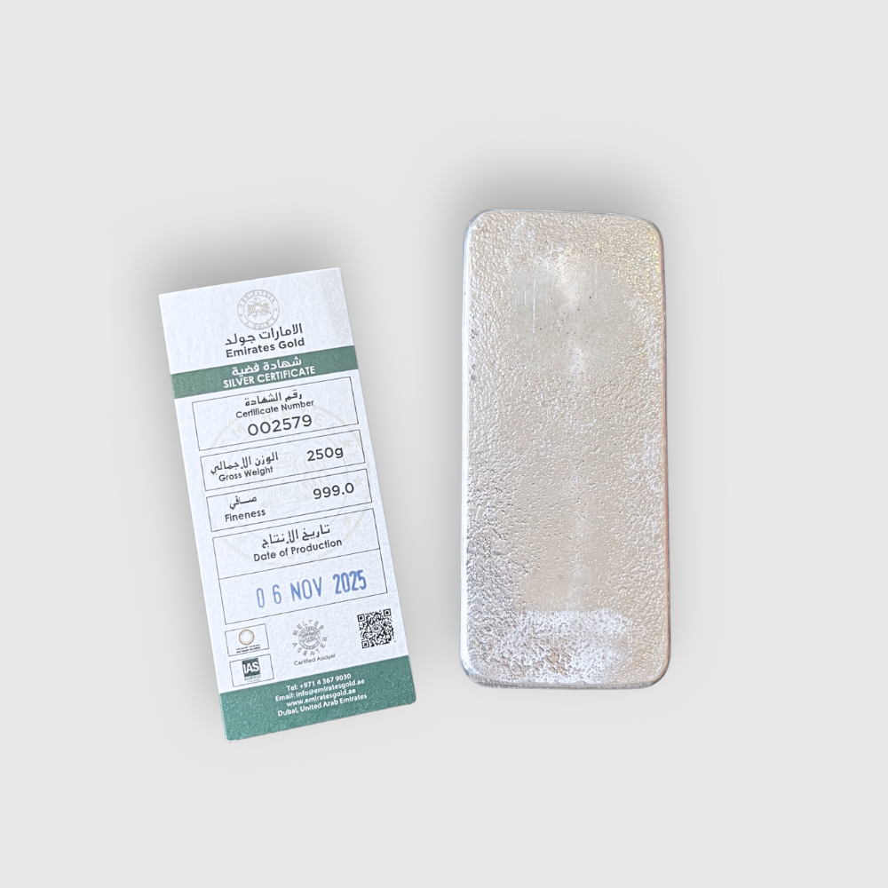 Silver Emirates Gold bar with its packaging on a light gray background