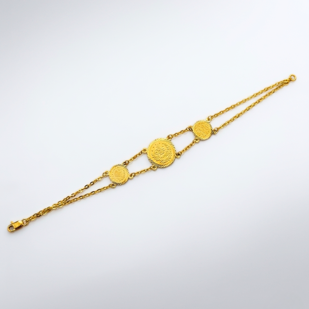 21k Gold bracelet with coin-shaped charms on a white background