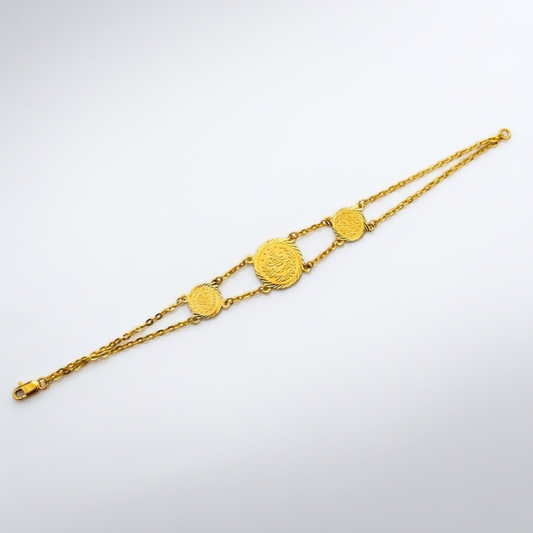 21k Gold bracelet with coin-shaped charms on a white background