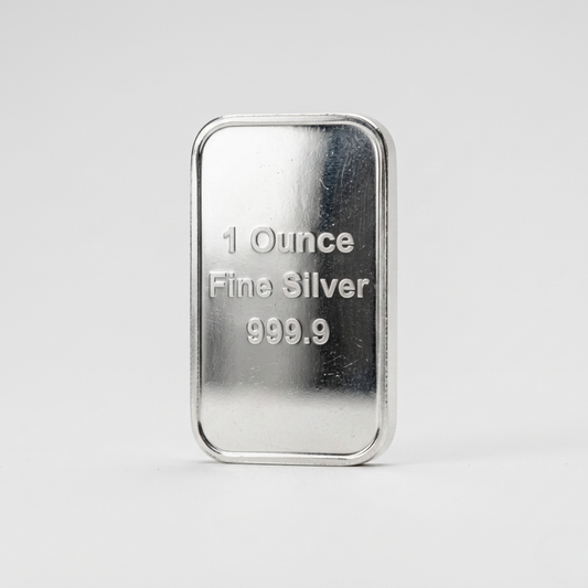Silver bar labeled '1 Ounce Fine Silver 999.9' on a white background