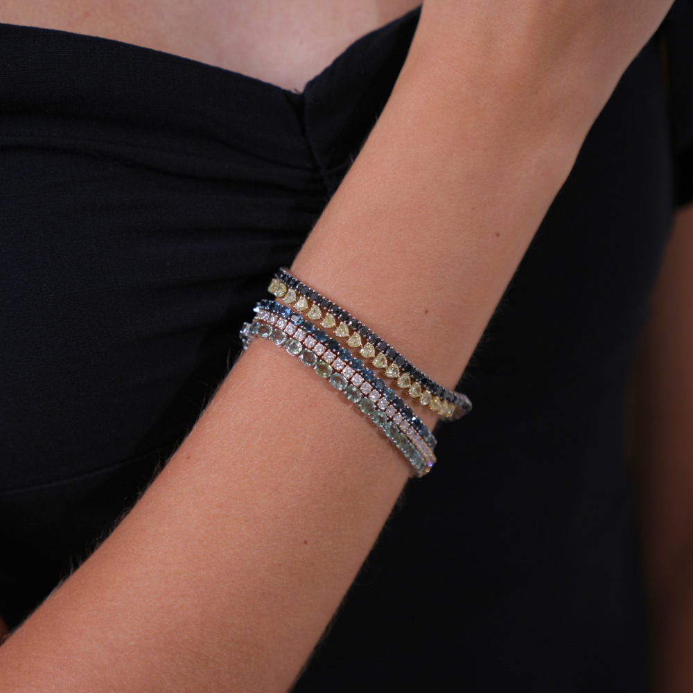 stack of precious stones tennis bracelets