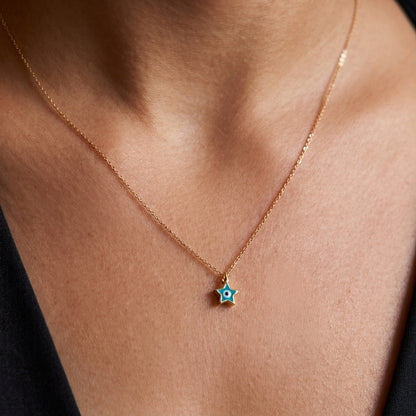 Mini star and eye – gold necklace