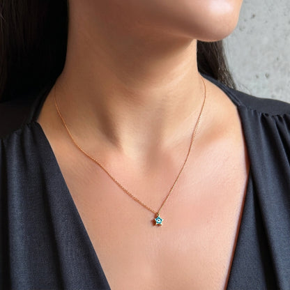 Mini star and eye – gold necklace