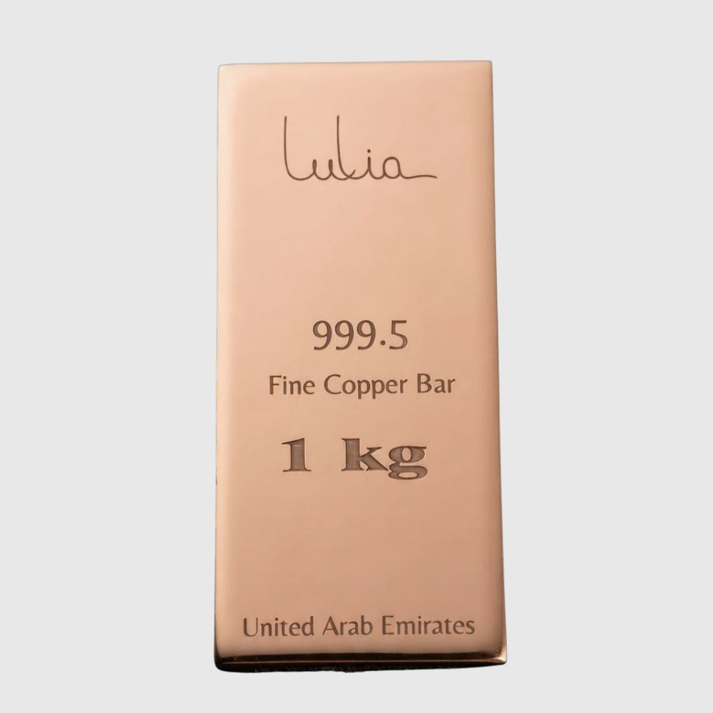 A 1 kg copper bar from the brand Lulia, presented in its original metallic rose-gold colored packaging against a light gray background.