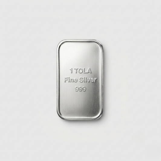 Silver bar with '1 TOLA Fine Silver 999' text on a light gray background