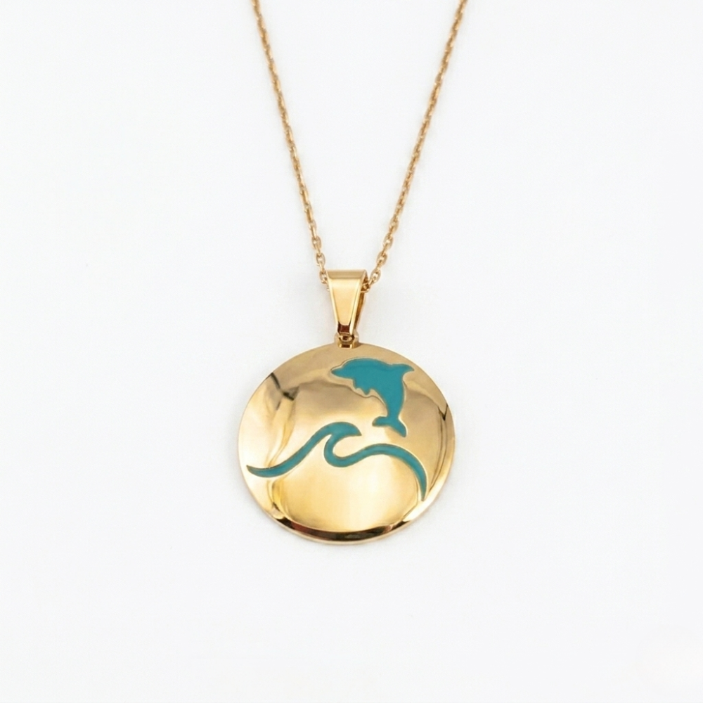 That's so summer - lulia jewelry Gold necklace with a round pendant featuring a dolphin and wave design on a white background